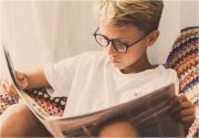 Boy reading newspaper (Image: Conversation, Shutterstock)